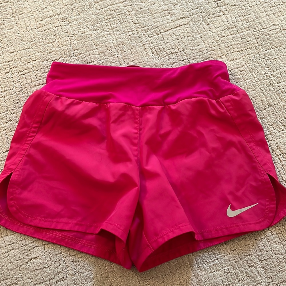 Nike hot pink running shorts!! About a 3 inch inseam and not sold anymore!